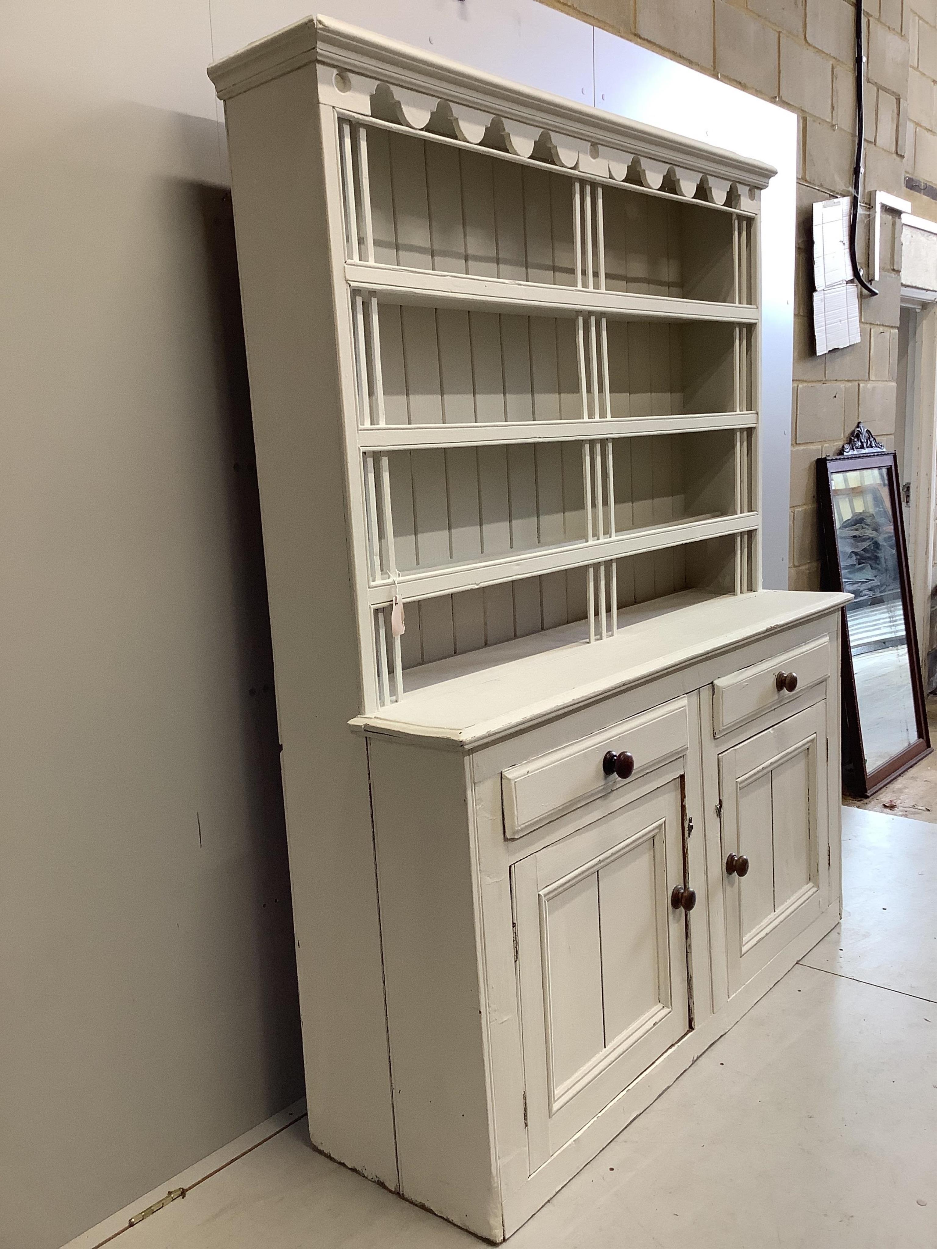 A 19th century Irish pine dresser with boarded rack, later painted, width 162cm, depth 49cm, height 201cm. Condition - fair
